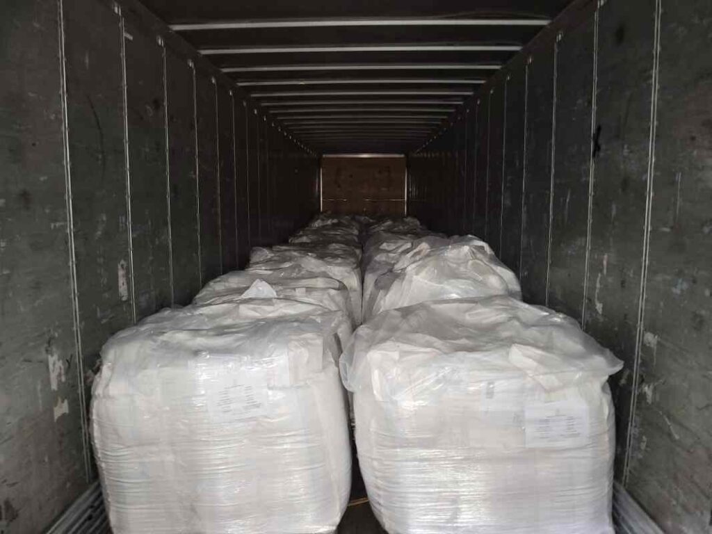 Trailer interior fully loaded with bulk bag rice pallets ready for cross-dock transfer