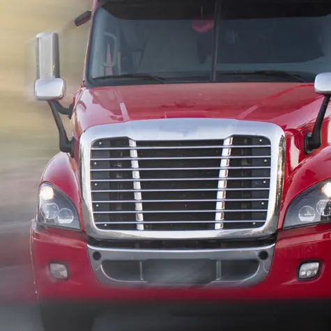 Expedited Freight - semi truck moving down the highway carrying a load